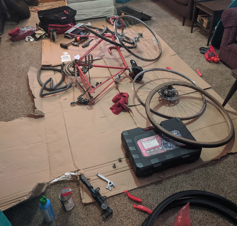 My bicycle being worked on in a living room