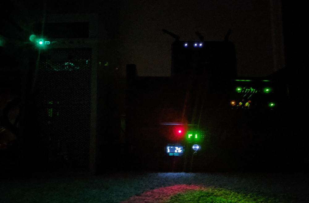 Server rack with status lights shining in the dark